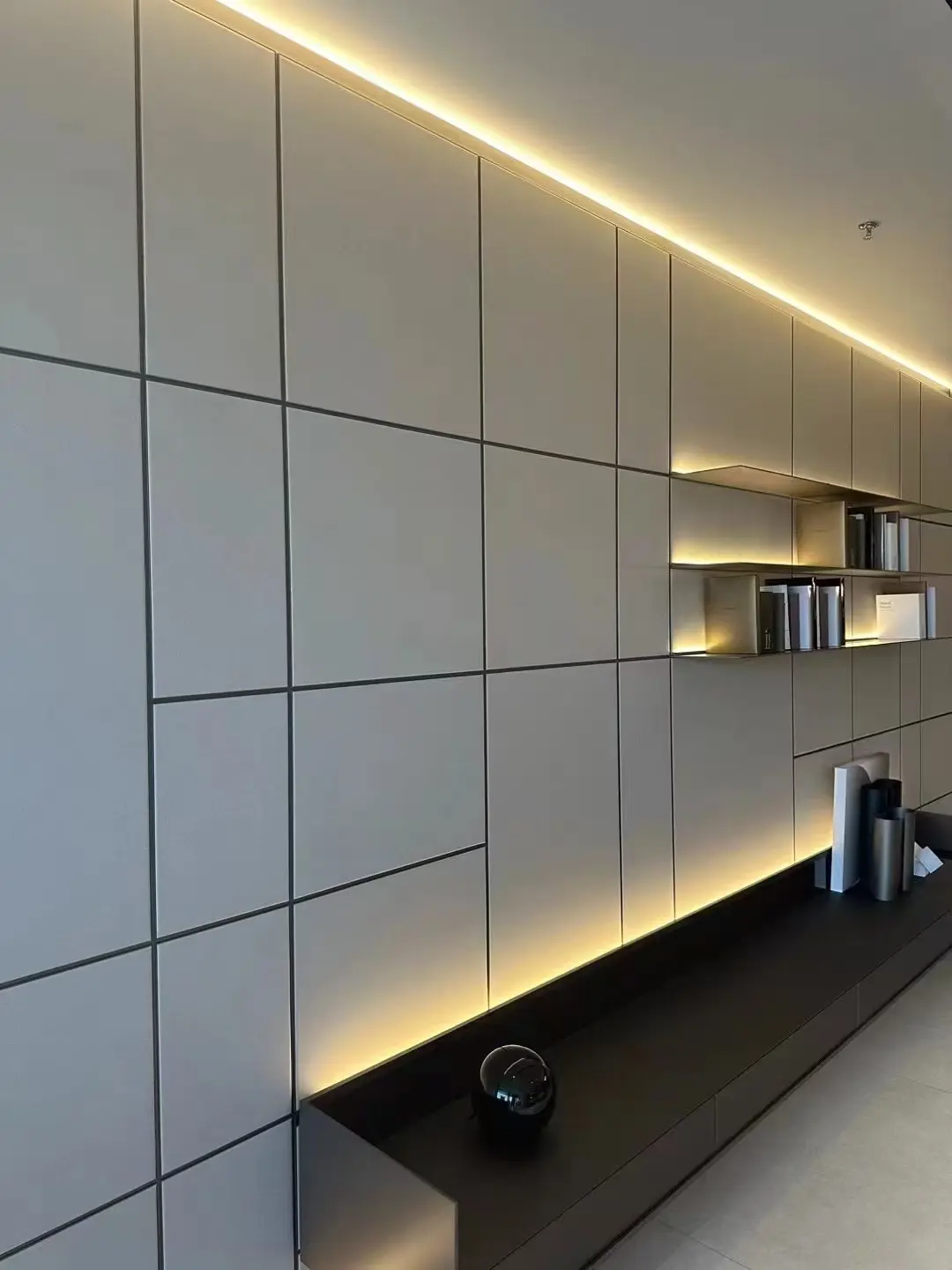Illuminated modular wall panels with inset display shelves and low storage