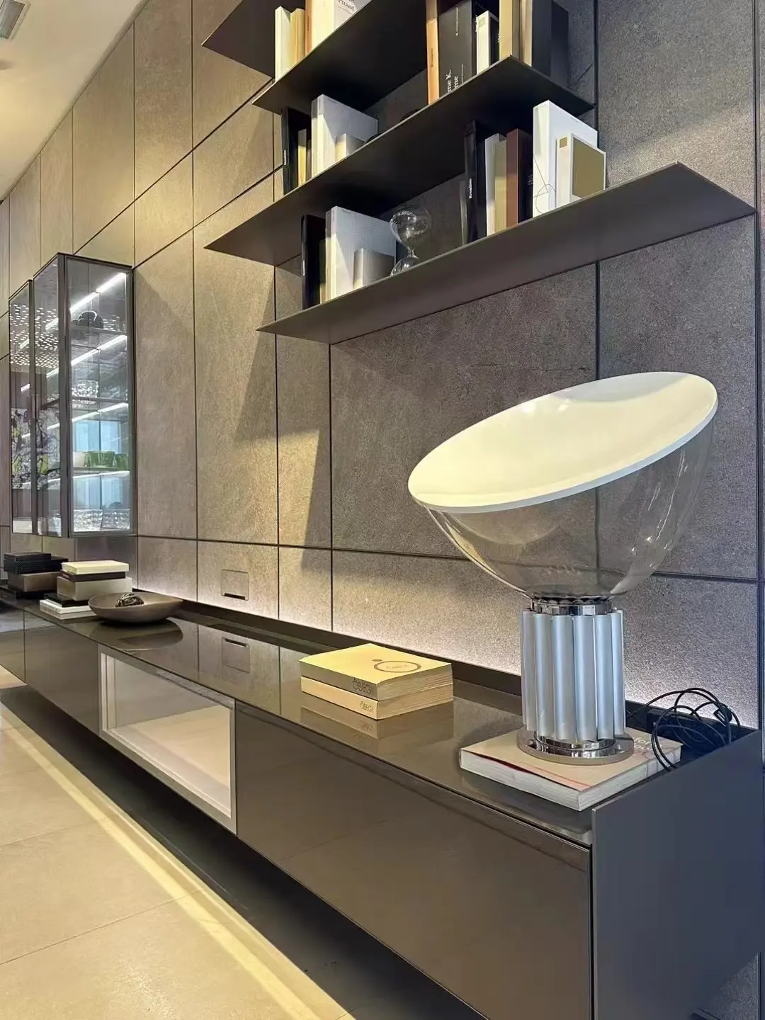 Detail view of open shelves and low cabinetry in an integrated media wall
