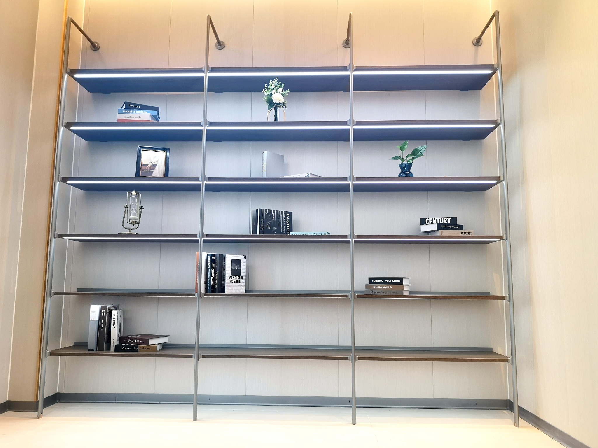 Front view of full-height illuminated post shelving