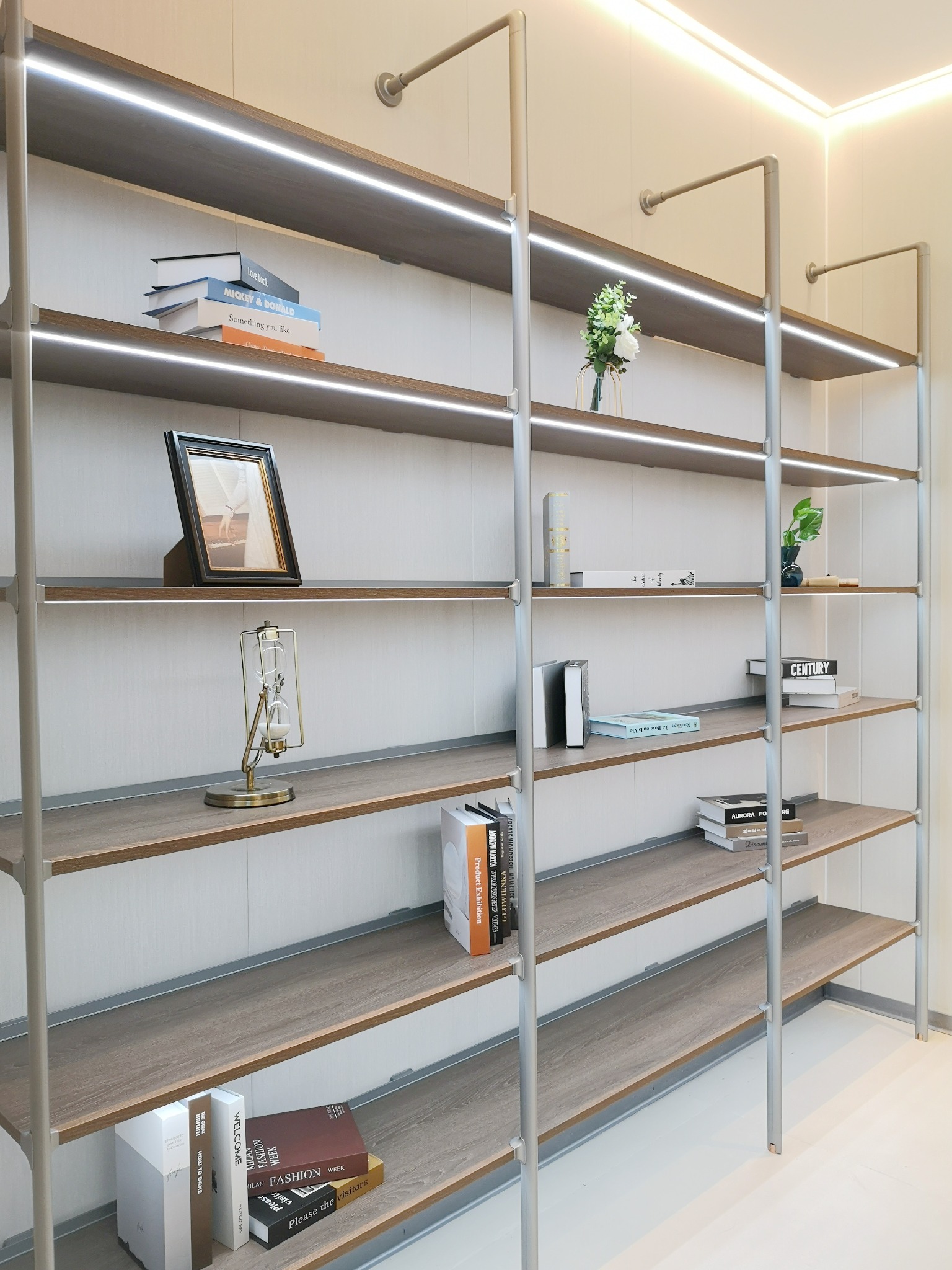 Angled view across long illuminated shelves and uprights
