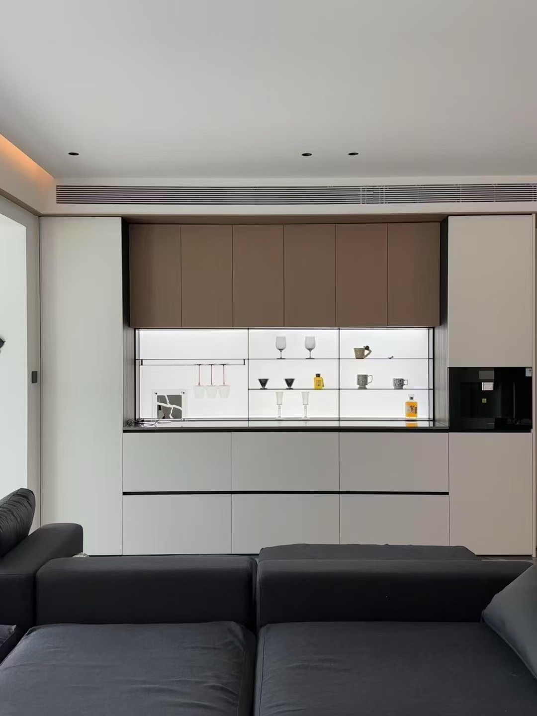 Integrated living-room bar and illuminated display wall